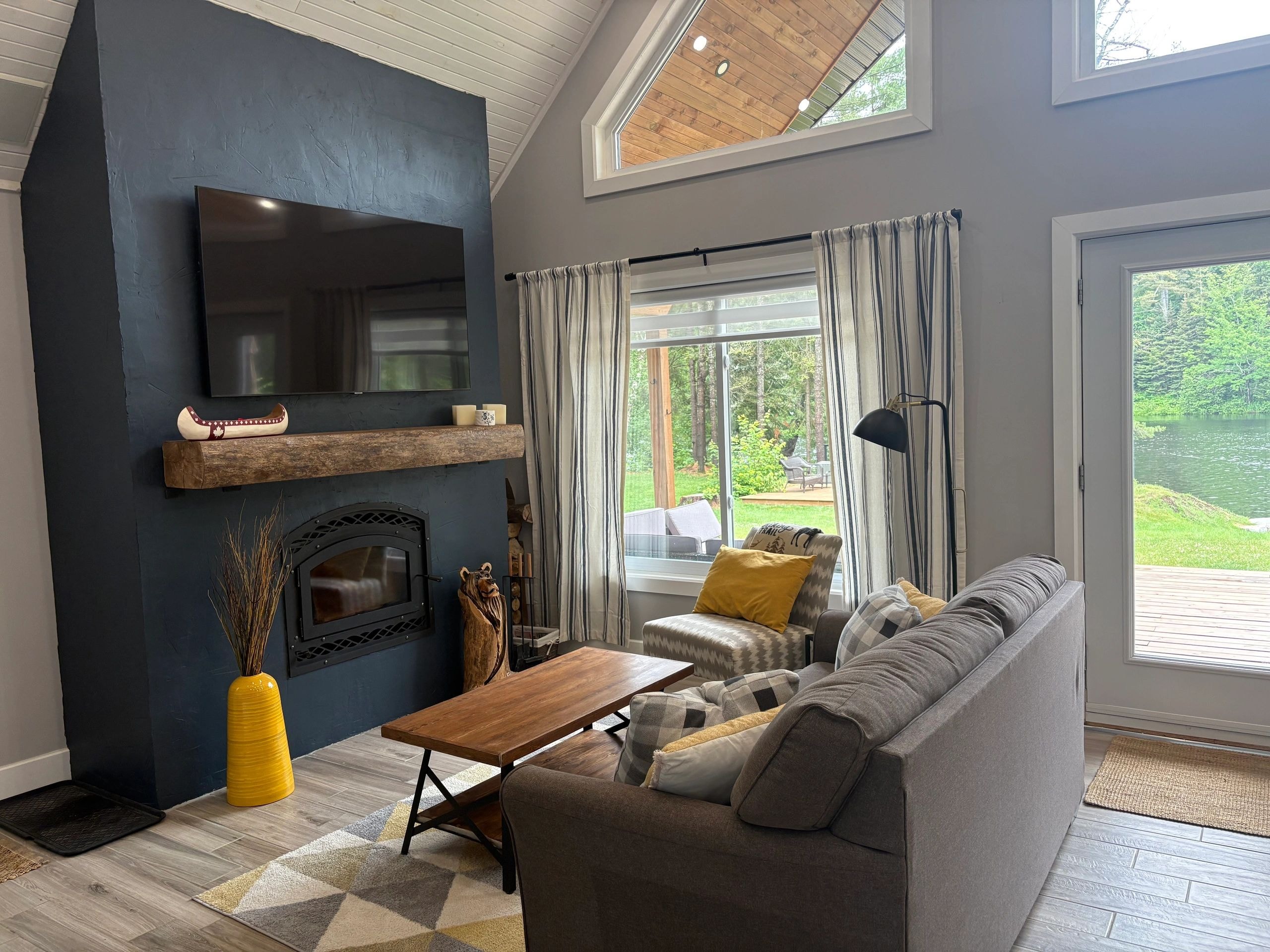 Living room with fireplace and TV